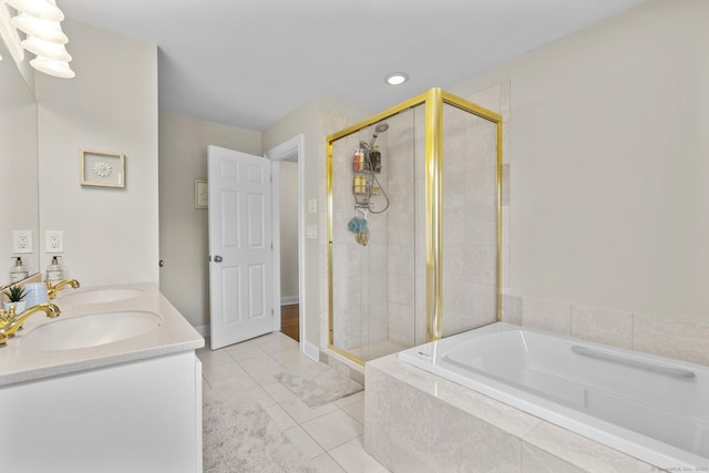 190 Bayview Blvd, Stratford, CT 06615 - full bath featuring a stall shower, a bath, double vanity, tile patterned flooring, and recessed lighting