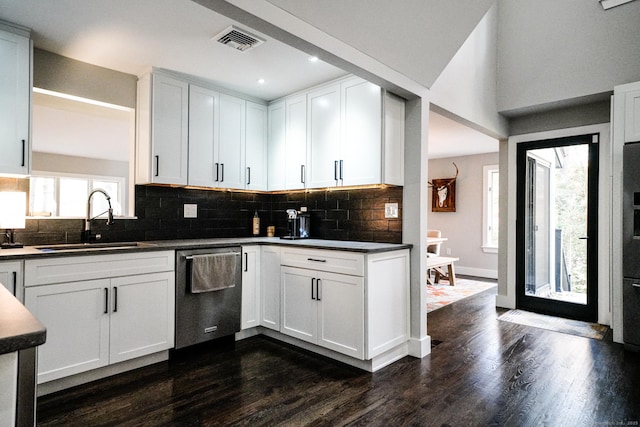 8 Bruce Ln, Avon, CT 06001 - kitchen featuring stainless steel dishwasher, a sink, dark wood-style floors, tasteful backsplash, and dark countertops