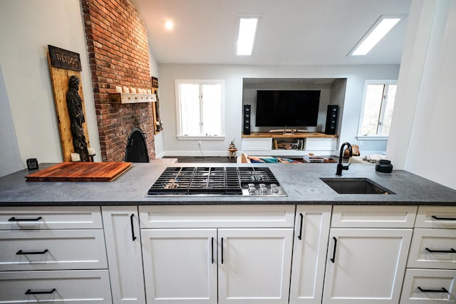 8 Bruce Ln, Avon, CT 06001 - kitchen with a sink, stainless steel gas cooktop, white cabinetry, and healthy amount of natural light