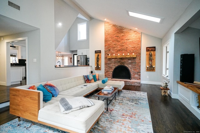 8 Bruce Ln, Avon, CT 06001 - living area with wood finished floors, a brick fireplace, high vaulted ceiling, and baseboards