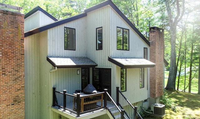 8 Bruce Ln, Avon, CT 06001 - view of front of home with a chimney, central air condition unit, and a shingled roof