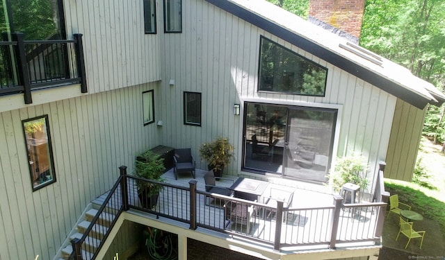 8 Bruce Ln, Avon, CT 06001 - back of property with a deck and a chimney