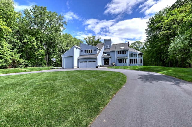 55 Hampton Close Close, Orange, CT 06477 - view of front facade with a front lawn, asphalt driveway, and stucco siding