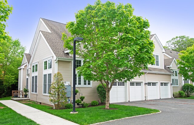 78 Copper Square Dr Unit 78, Bethel, CT 06801 - view of front of house with roof with shingles, asphalt driveway, a front yard, and an attached garage