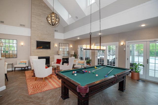 78 Copper Square Dr Unit 78, Bethel, CT 06801 - playroom with high vaulted ceiling, a chandelier, a large fireplace, pool table, and french doors