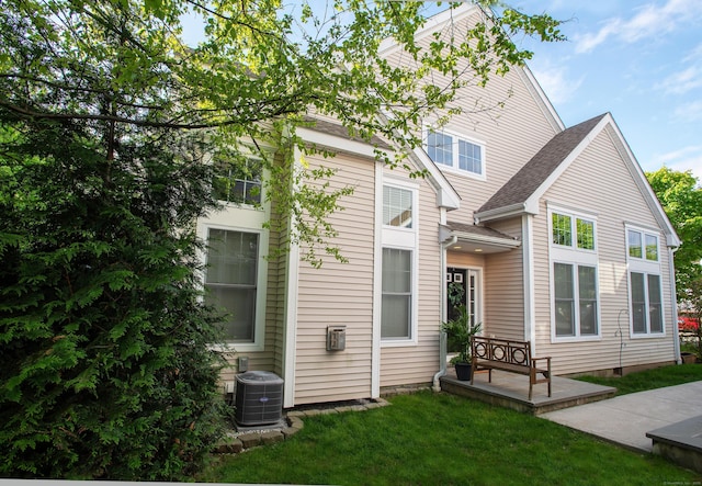 78 Copper Square Dr Unit 78, Bethel, CT 06801 - rear view of house with central air condition unit and a yard