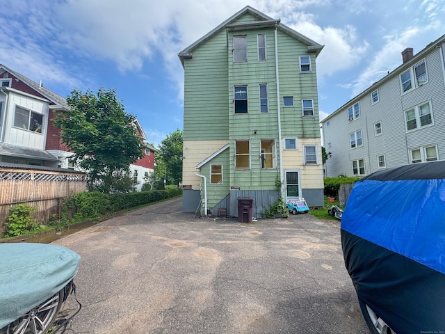 back of property with fence