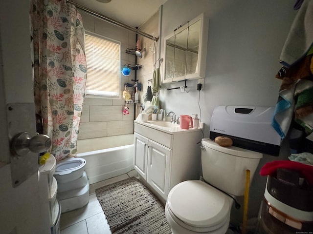 bathroom featuring toilet, tile patterned flooring, shower / bathtub combination with curtain, and vanity