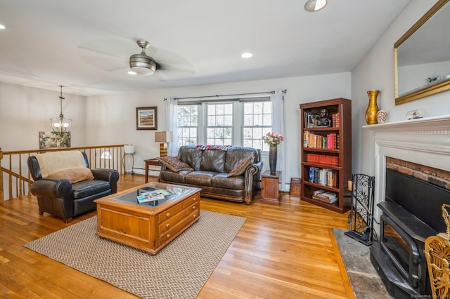 90 Akbar Rd, Stamford, CT 06902 - living room with a ceiling fan, light wood-style flooring, recessed lighting, baseboard heating, and a chandelier