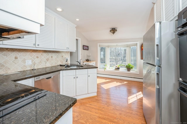 90 Akbar Rd, Stamford, CT 06902 - kitchen featuring stainless steel appliances, a sink, baseboard heating, light wood finished floors, and recessed lighting