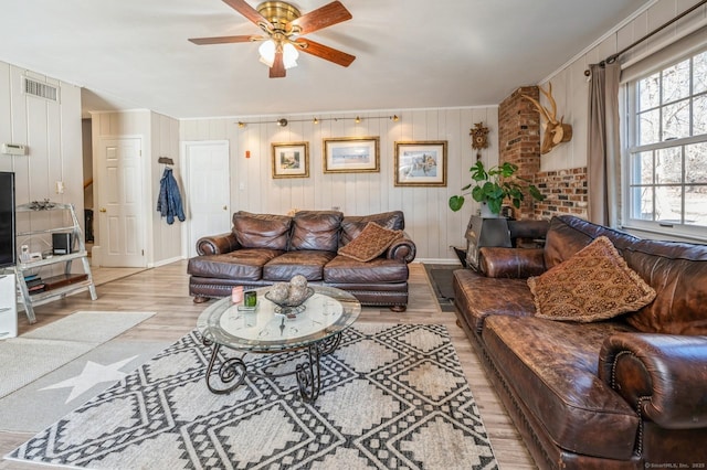 90 Akbar Rd, Stamford, CT 06902 - living area featuring light wood-style floors, crown molding, a ceiling fan, and baseboards