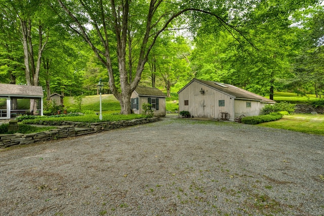 80 W Main St, Chester, CT 06412 - view of side of home featuring an outbuilding and gravel driveway