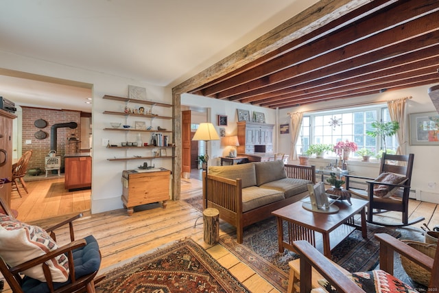 80 W Main St, Chester, CT 06412 - living room with a wood stove, light wood-style flooring, and beam ceiling