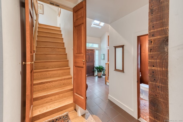 80 W Main St, Chester, CT 06412 - stairs with tile patterned floors, baseboards, and a skylight