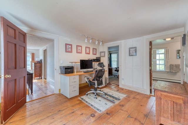 80 W Main St, Chester, CT 06412 - home office with a baseboard radiator, light wood-style floors, and track lighting
