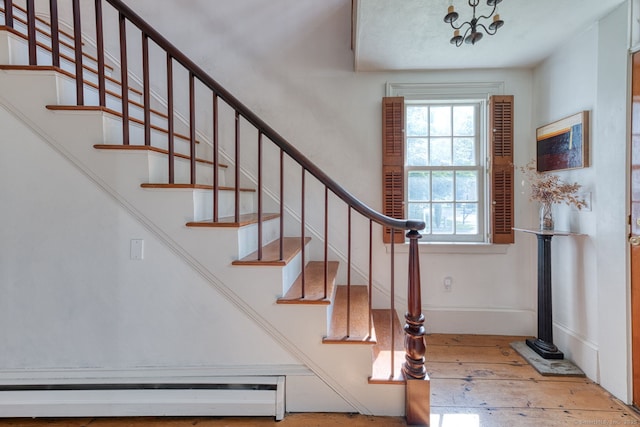 80 W Main St, Chester, CT 06412 - entrance foyer with a baseboard radiator, hardwood / wood-style floors, stairway, a chandelier, and baseboards