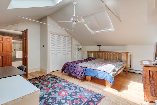 80 W Main St, Chester, CT 06412 - bedroom with a skylight, light wood finished floors, a baseboard heating unit, vaulted ceiling, and a closet