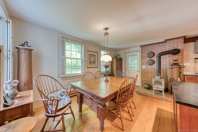 80 W Main St, Chester, CT 06412 - dining area featuring light wood-style floors and a wood stove