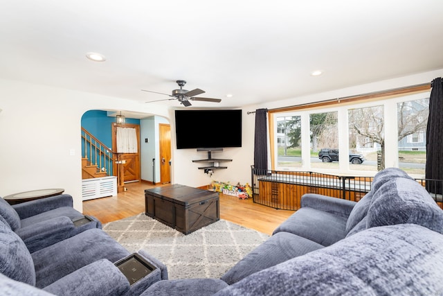 26 Davis Ave, Vernon, CT 06066 - living area featuring arched walkways, stairway, wood finished floors, a ceiling fan, and recessed lighting