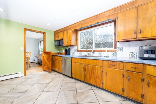 26 Davis Ave, Vernon, CT 06066 - kitchen with stainless steel dishwasher, black microwave, a sink, brown cabinets, and recessed lighting
