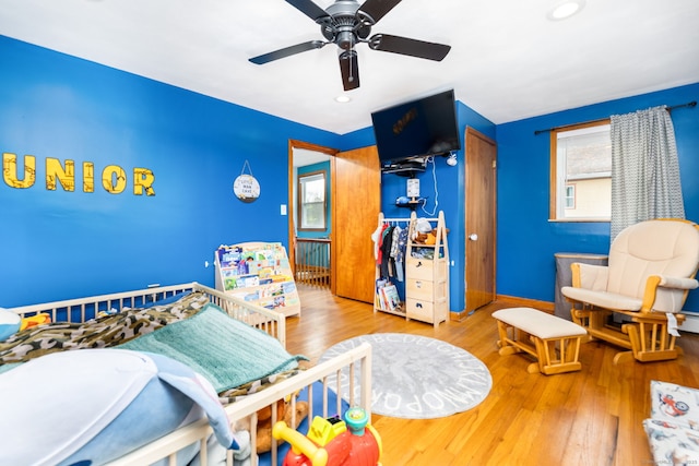 26 Davis Ave, Vernon, CT 06066 - bedroom with multiple windows, wood finished floors, recessed lighting, ceiling fan, and baseboards