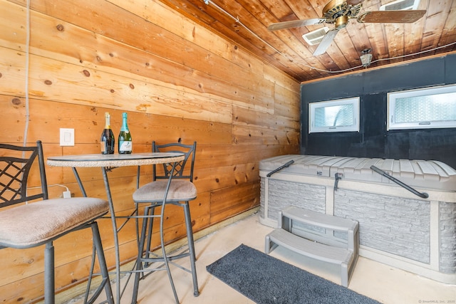 26 Davis Ave, Vernon, CT 06066 - misc room with wooden ceiling, wood walls, concrete floors, and a ceiling fan