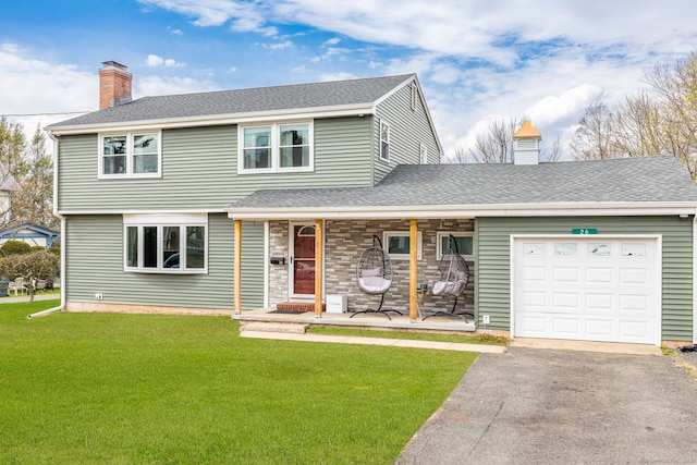 26 Davis Ave, Vernon, CT 06066 - view of front of property with a chimney, covered porch, a front lawn, and driveway