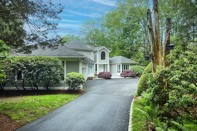15 Arrowhead Way, Weston, CT 06883 - view of front of home featuring driveway and a shingled roof