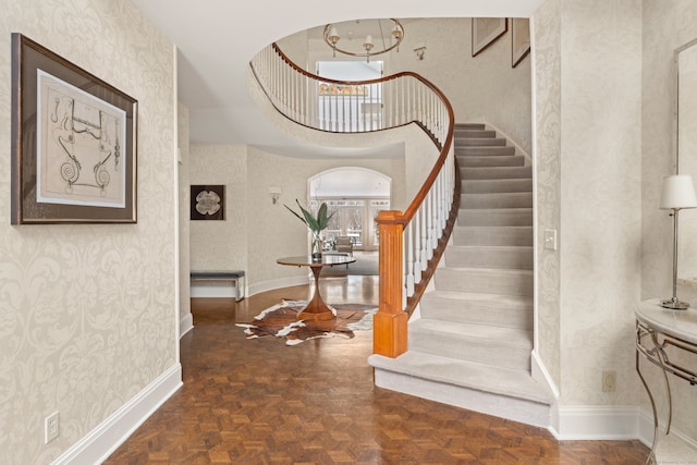 15 Arrowhead Way, Weston, CT 06883 - entryway with wallpapered walls, stairs, and baseboards