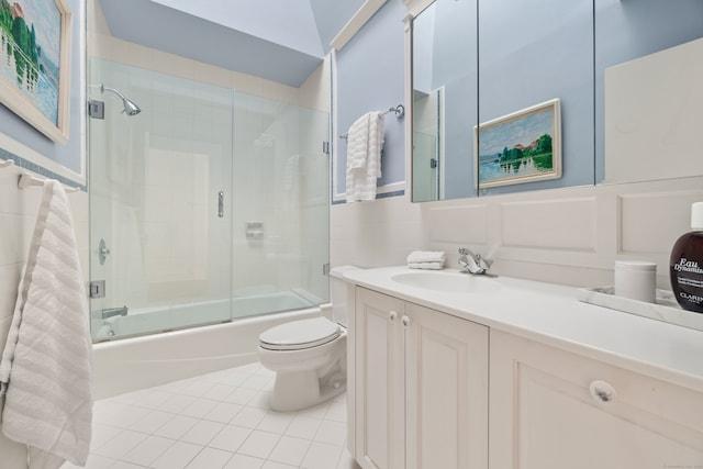 15 Arrowhead Way, Weston, CT 06883 - bathroom with tile patterned flooring, shower / bath combination with glass door, toilet, vanity, and a wainscoted wall