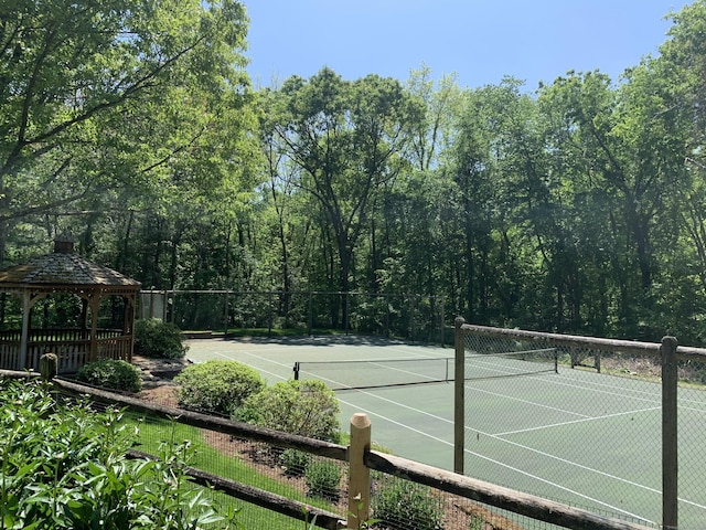 15 Arrowhead Way, Weston, CT 06883 - view of tennis court featuring a gazebo and fence