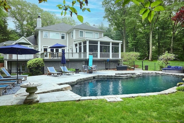 15 Arrowhead Way, Weston, CT 06883 - back of house featuring a sunroom, a patio area, and a chimney
