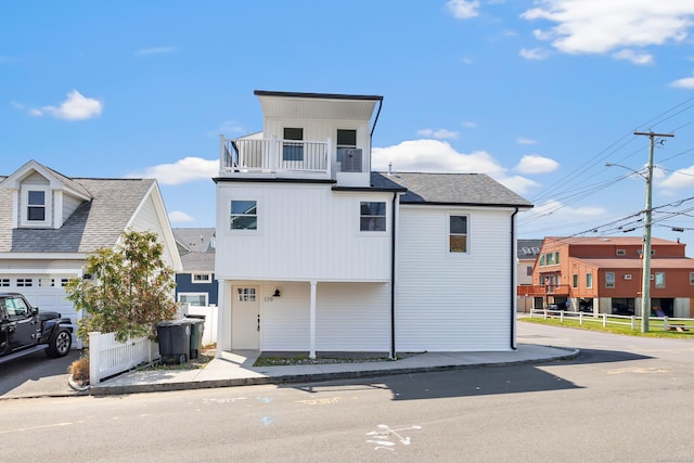 119 Melba St, Milford, CT 06460 - view of front of property featuring a balcony, fence, and roof with shingles