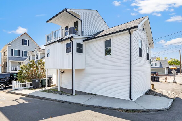 119 Melba St, Milford, CT 06460 - view of front of house with a balcony, fence, and cooling unit