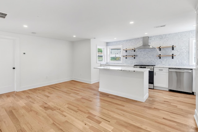119 Melba St, Milford, CT 06460 - kitchen featuring appliances with stainless steel finishes, wall chimney range hood, open shelves, tasteful backsplash, and a kitchen island