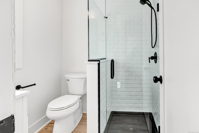 119 Melba St, Milford, CT 06460 - bathroom featuring a stall shower, toilet, and baseboards