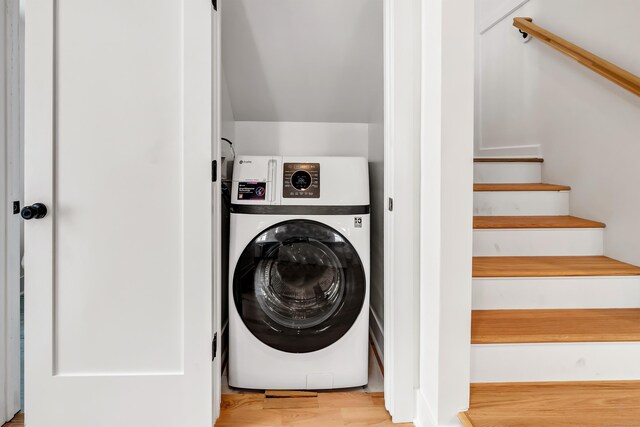 119 Melba St, Milford, CT 06460 - clothes washing area with washer / dryer and wood finished floors