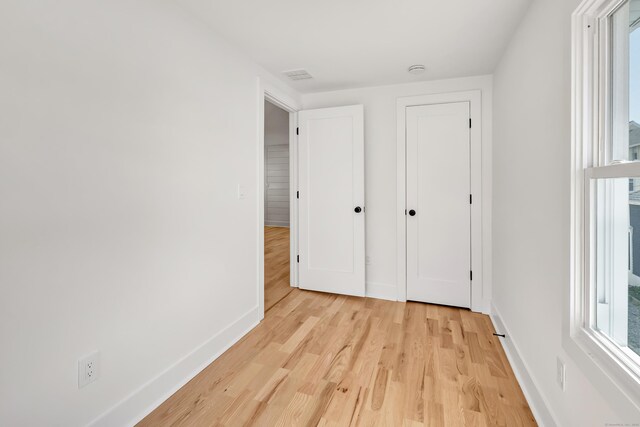 119 Melba St, Milford, CT 06460 - unfurnished bedroom with light wood-style floors and baseboards