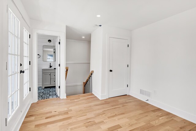 119 Melba St, Milford, CT 06460 - unfurnished room with light wood finished floors, recessed lighting, baseboards, and healthy amount of natural light