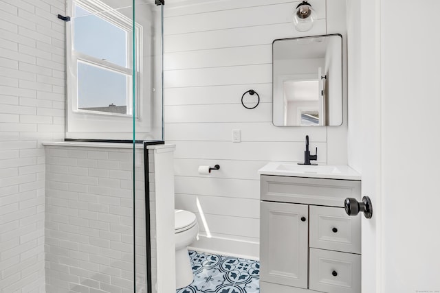 119 Melba St, Milford, CT 06460 - bathroom with toilet, vanity, tiled shower, and tile patterned flooring