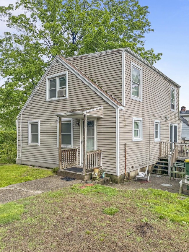 6 Peach St, Waterbury, CT 06708 - view of front of house featuring a front lawn, cooling unit, and a wooden deck