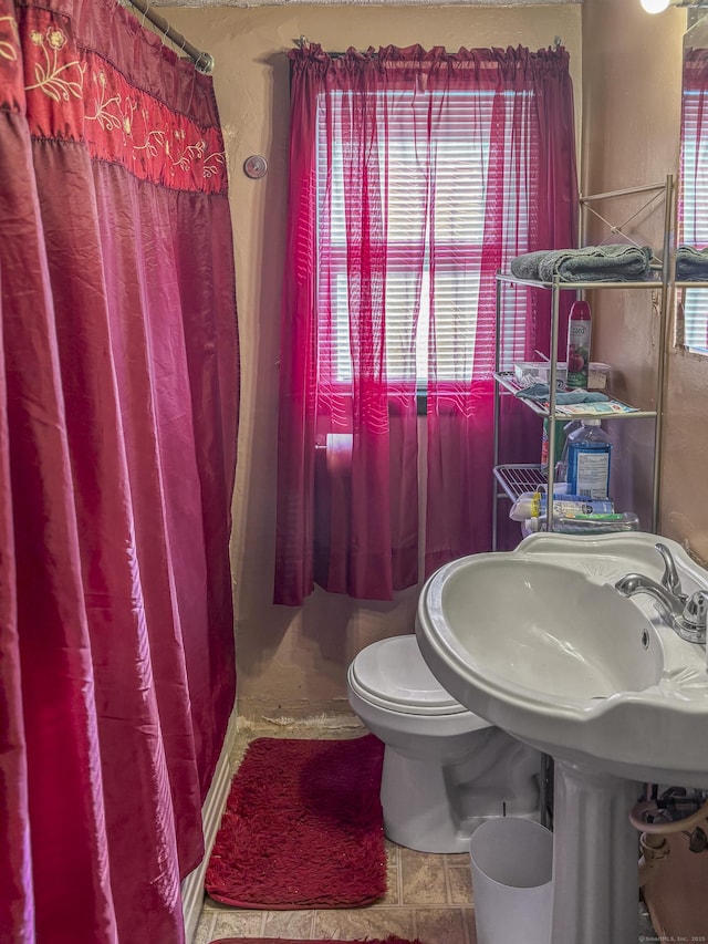 6 Peach St, Waterbury, CT 06708 - bathroom with toilet and a shower with shower curtain