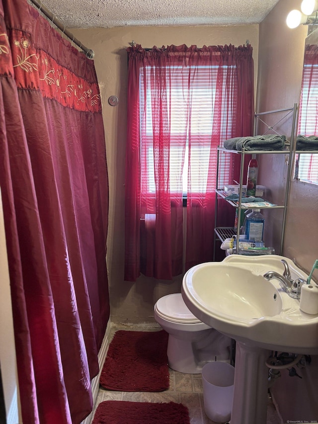 6 Peach St, Waterbury, CT 06708 - bathroom featuring a textured ceiling and toilet