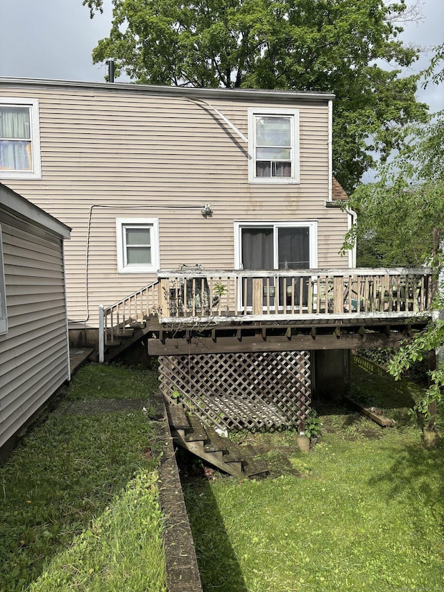 6 Peach St, Waterbury, CT 06708 - rear view of property featuring a wooden deck and a lawn