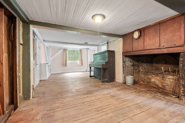 3 Indian Hill Ave, Portland, CT 06480 - unfurnished living room with light wood-style floors, a fireplace, beam ceiling, wooden ceiling, and brick wall