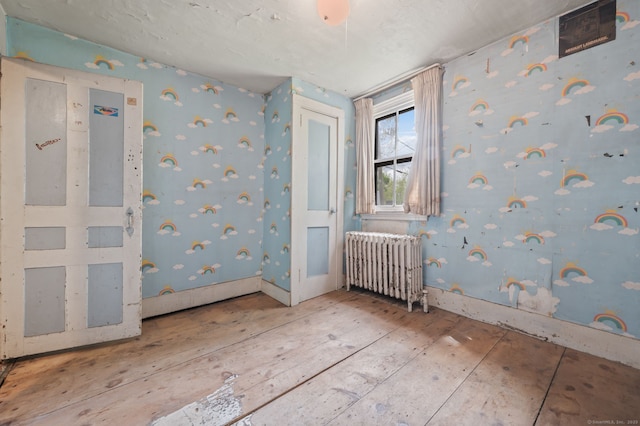 3 Indian Hill Ave, Portland, CT 06480 - empty room featuring radiator and wallpapered walls
