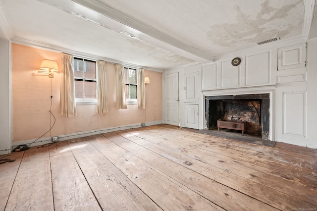 3 Indian Hill Ave, Portland, CT 06480 - unfurnished living room with a fireplace with flush hearth, light wood finished floors, and baseboards
