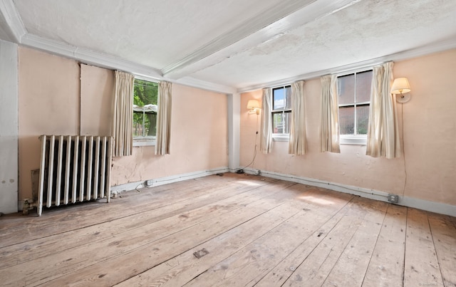 3 Indian Hill Ave, Portland, CT 06480 - empty room featuring radiator heating unit, hardwood / wood-style floors, and ornamental molding
