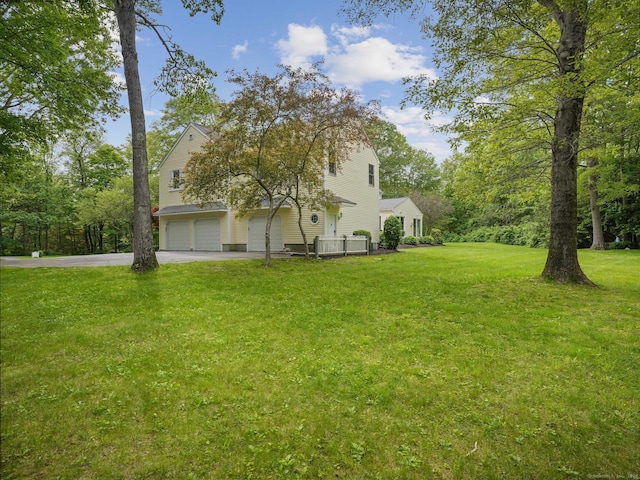 22 Fox Run, Wilton, CT 06897 - view of front of house featuring concrete driveway, a garage, and a front yard