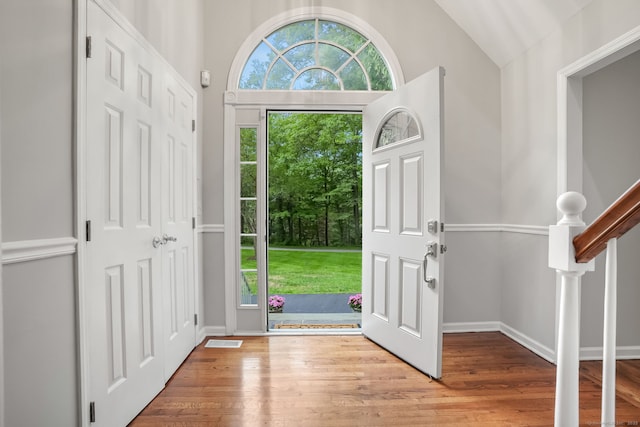 22 Fox Run, Wilton, CT 06897 - foyer entrance featuring wood finished floors, vaulted ceiling, and baseboards
